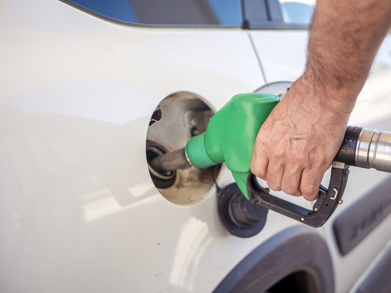 Person filling the car with fuel