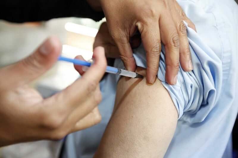 Person being vaccinated in the arm