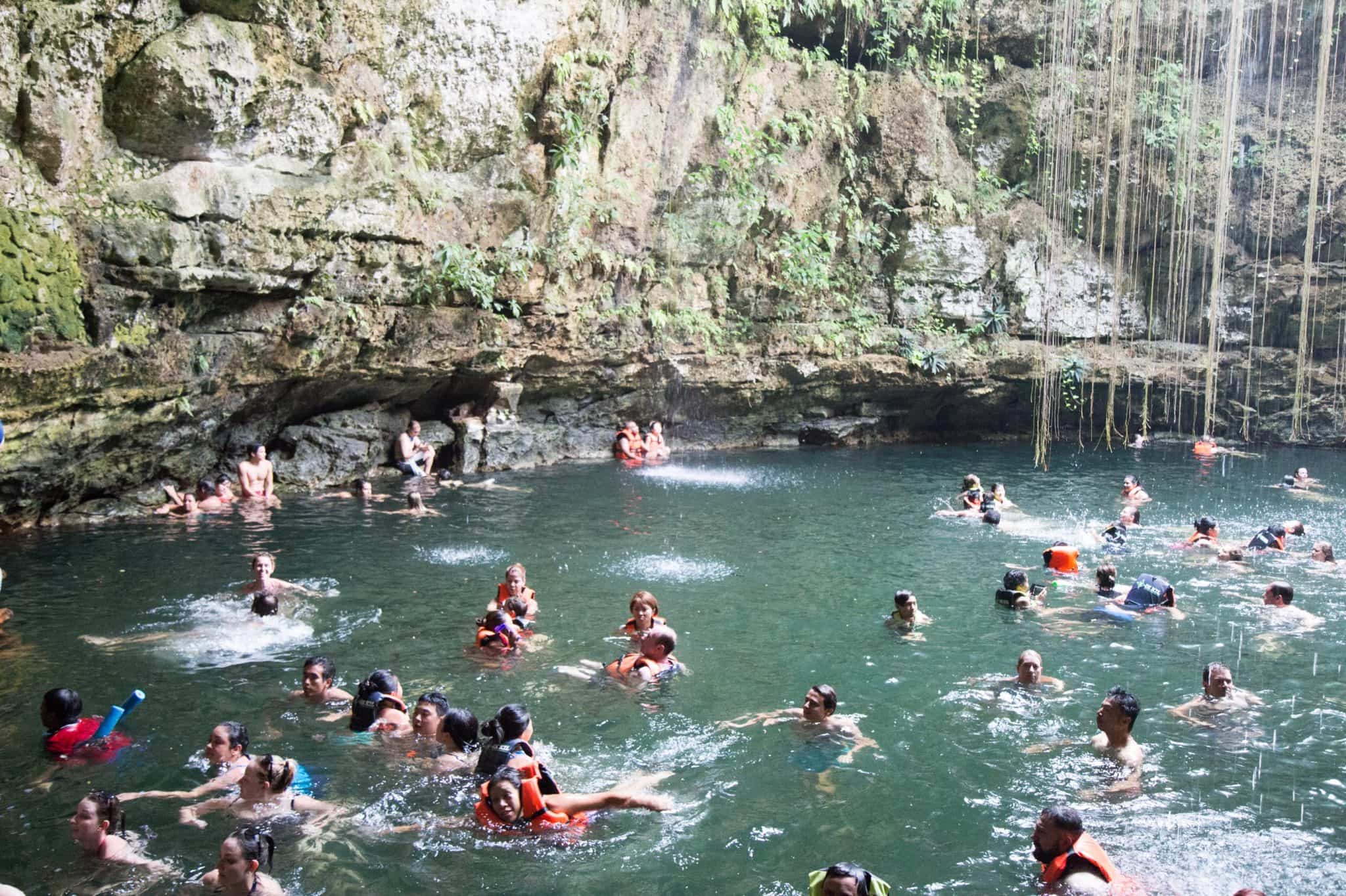 Tourists at Cenote Ik Kil in Cancun