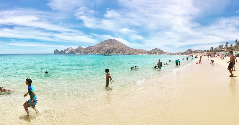 People enjoying Medano Beach in Los Cabos