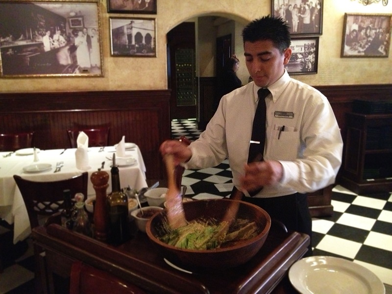 Waiter making Caesar salad at Caesar's Restaurant in Tijuana