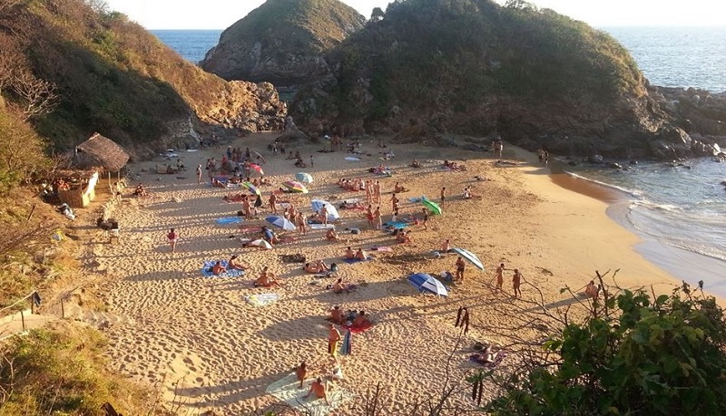 People enjoying Mazunte Beach in Puerto Escondido