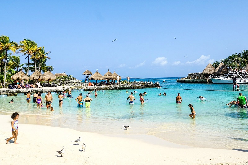 Tourists enjoying Cancun beach
